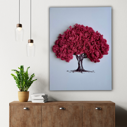 Wall art of a sakura tree on a light blue background in a room with a wooden cabinet and plant