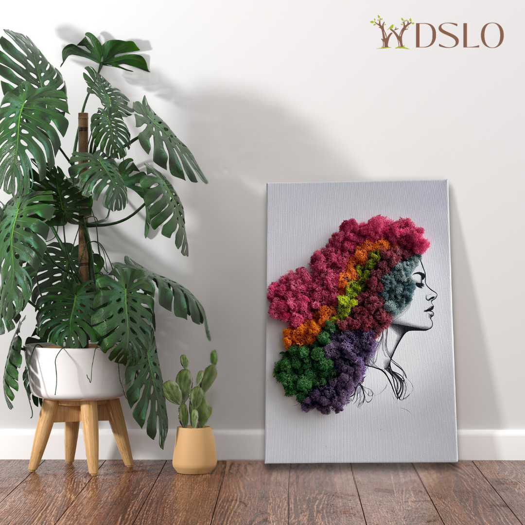 Colorful art piece of a woman's head with reindeer preserved moss on a wall. Shop WDSLO
