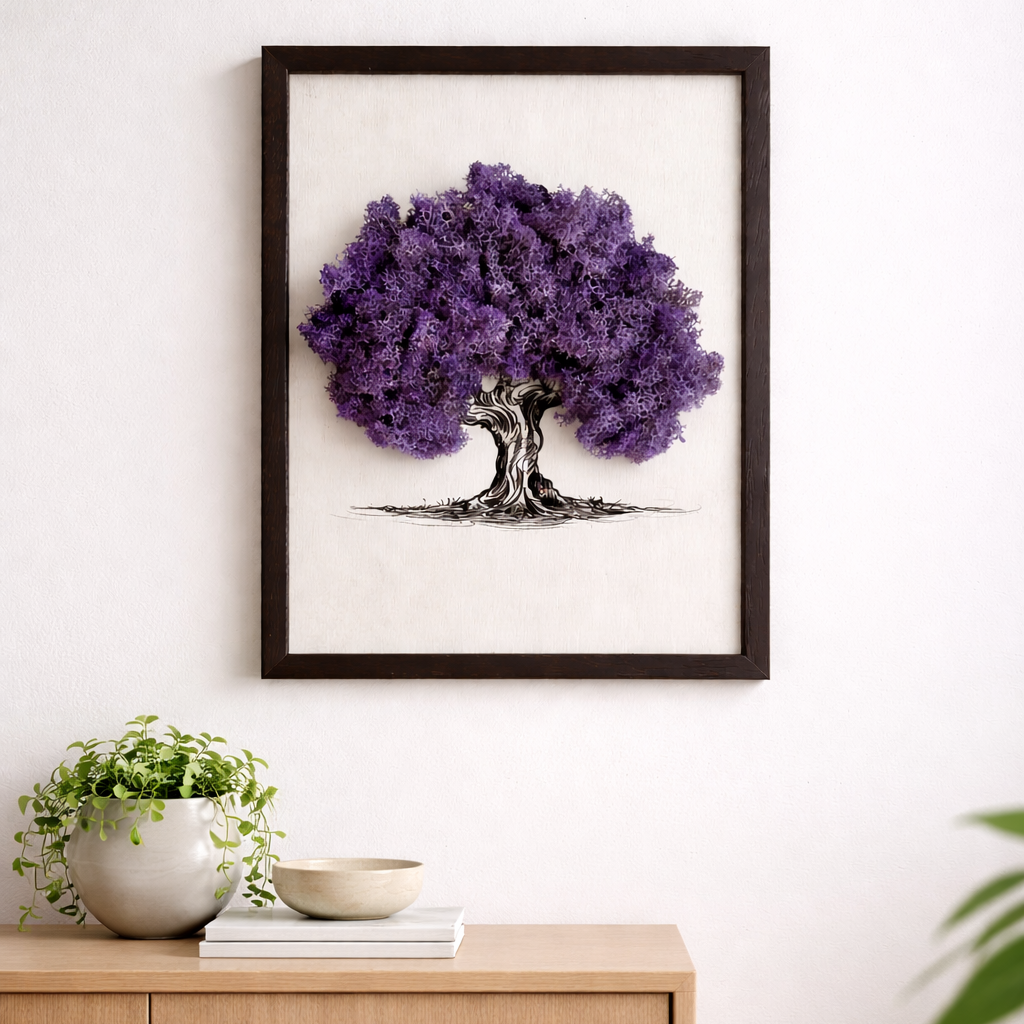 Framed artwork of a purple tree on a white wall above a wooden cabinet.